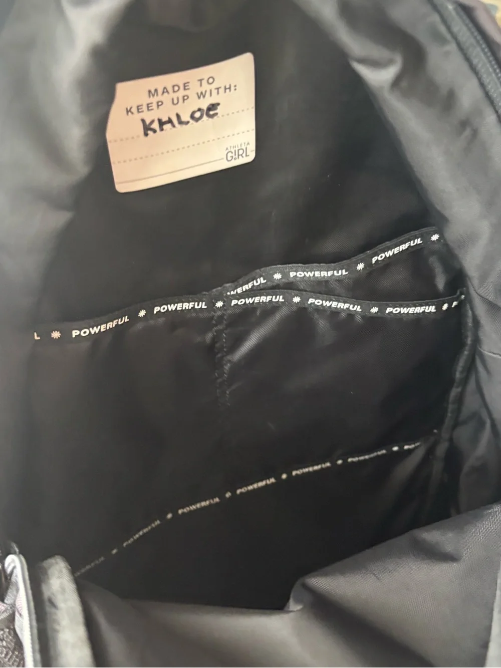 Athleta Black Interior Backpack Lining with 'POWERFUL' Trim. Great condition